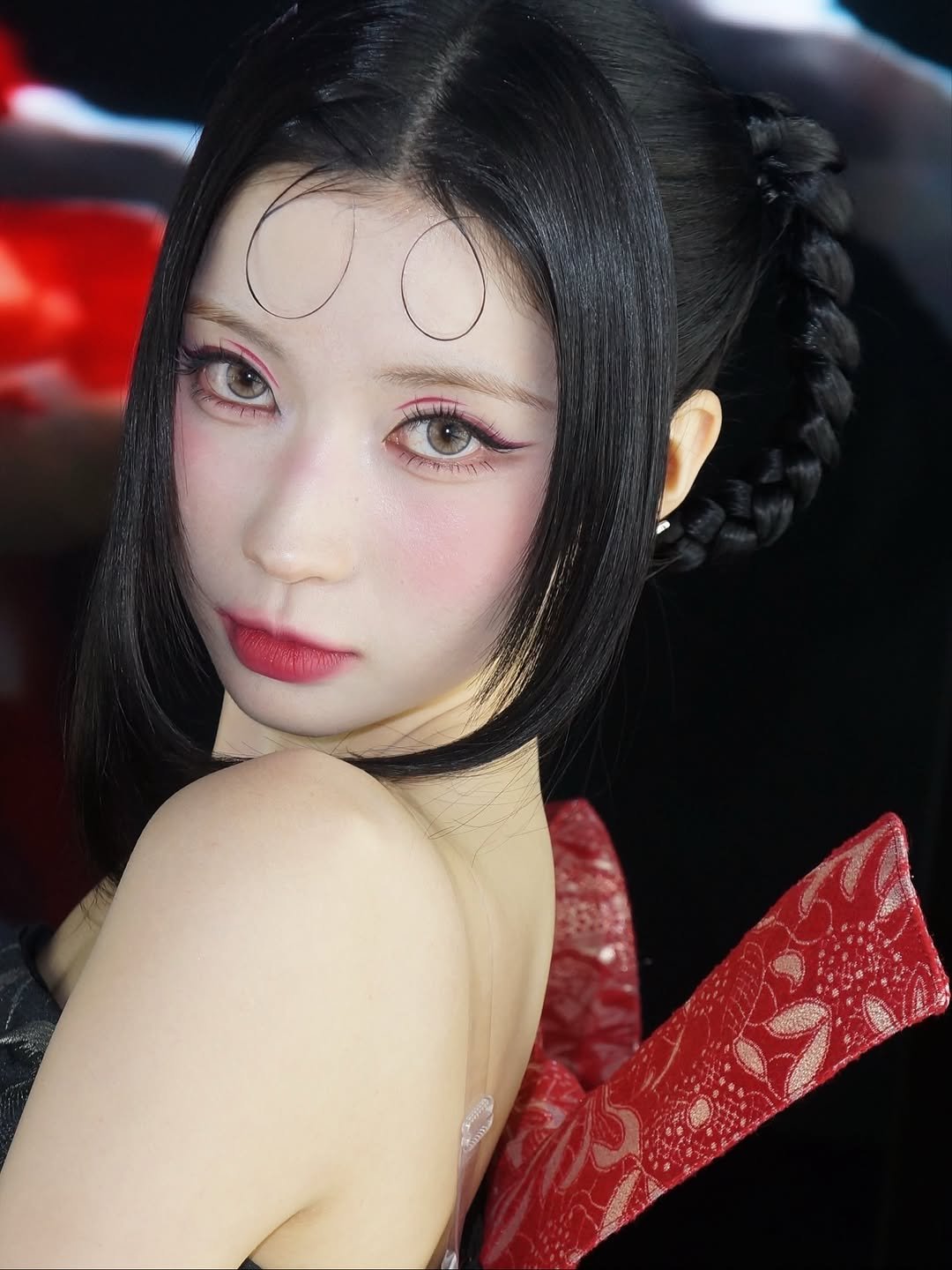 Photo by ENAMI ASA on November 26, 2025. May be a closeup of one or more people, braids, makeup, costume, headdress and text.