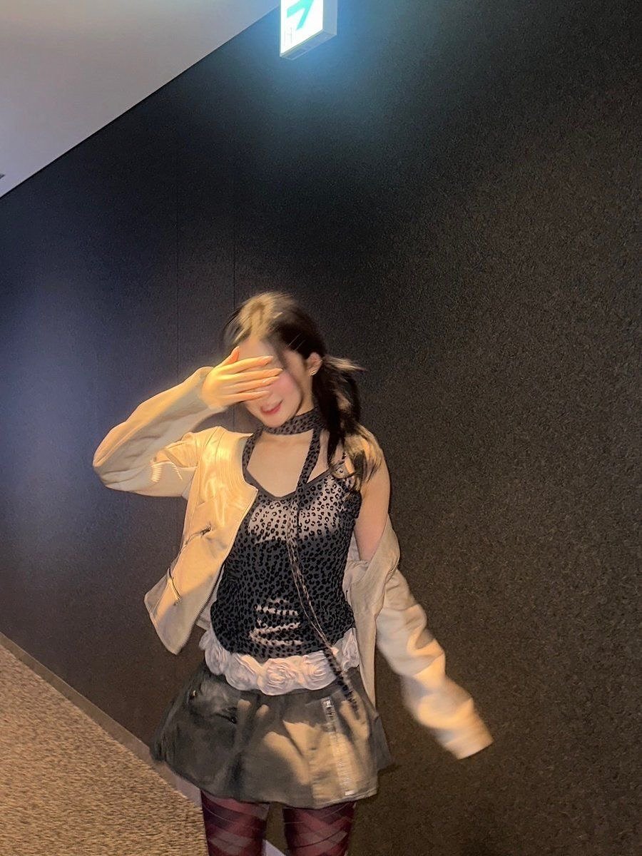 Photo by ENAMI ASA on November 14, 2025. May be an image of miniskirt, fishnet stockings and text.