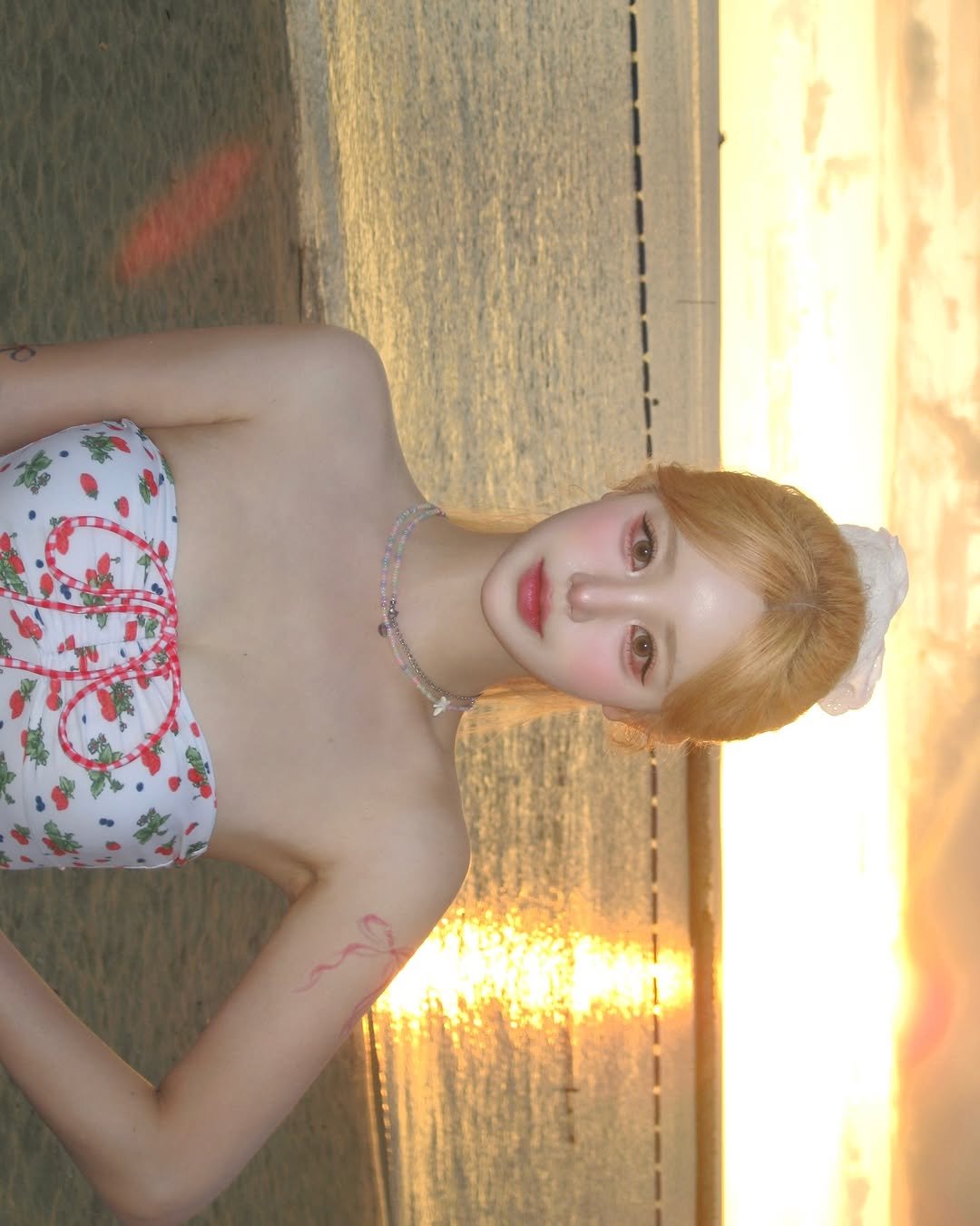 Photo shared by SUJIN ♥ on July 14, 2025 tagging @sonyounaclinic. May be an image of 1 person, makeup, beach and text.