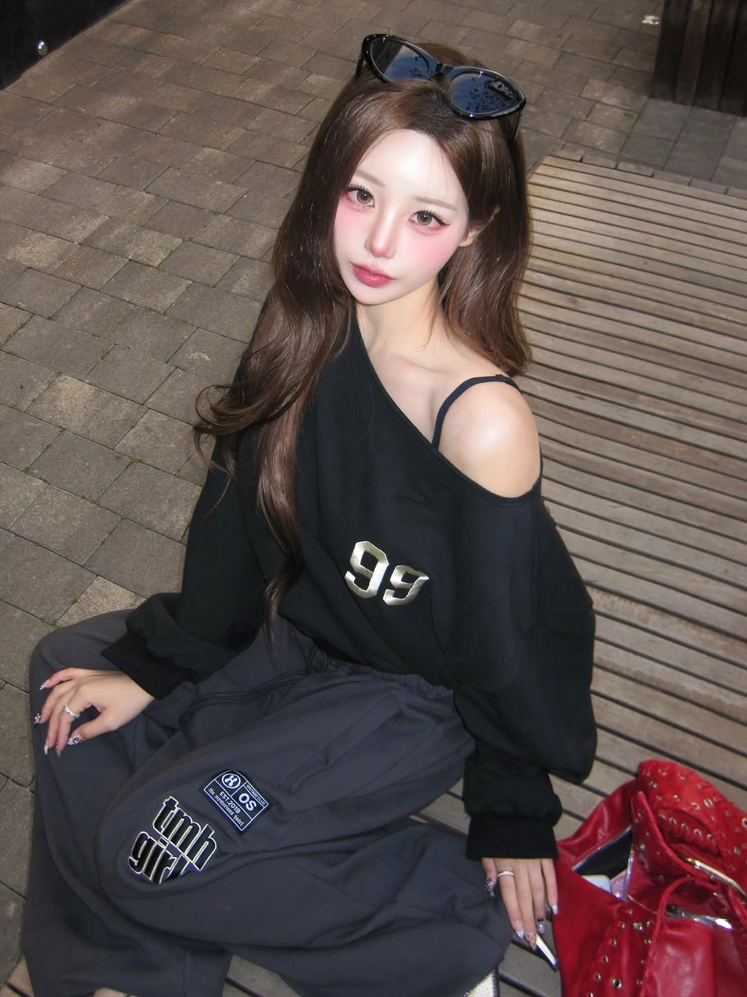 Photo shared by SUJIN ♥ on October 29, 2025 tagging @themysterioushotel_official. May be an image of one or more people, hair, sweatpants, top, parka, sweatshirt and text.