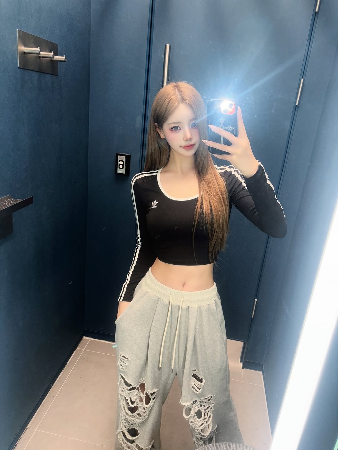 Photo by SUJIN ♥ on August 13, 2025. May be an image of 1 person, hair, sweatpants, top, sweatshirt, mirror and text.