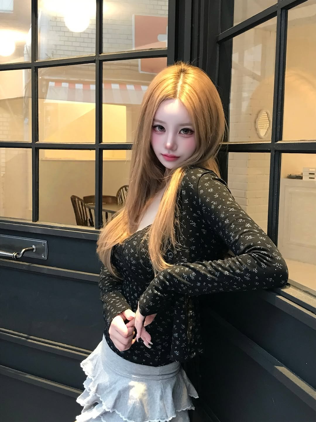 Photo by SUJIN ♥ on August 31, 2025. May be an image of 1 person, blonde hair, top, dress, miniskirt, costume and text.