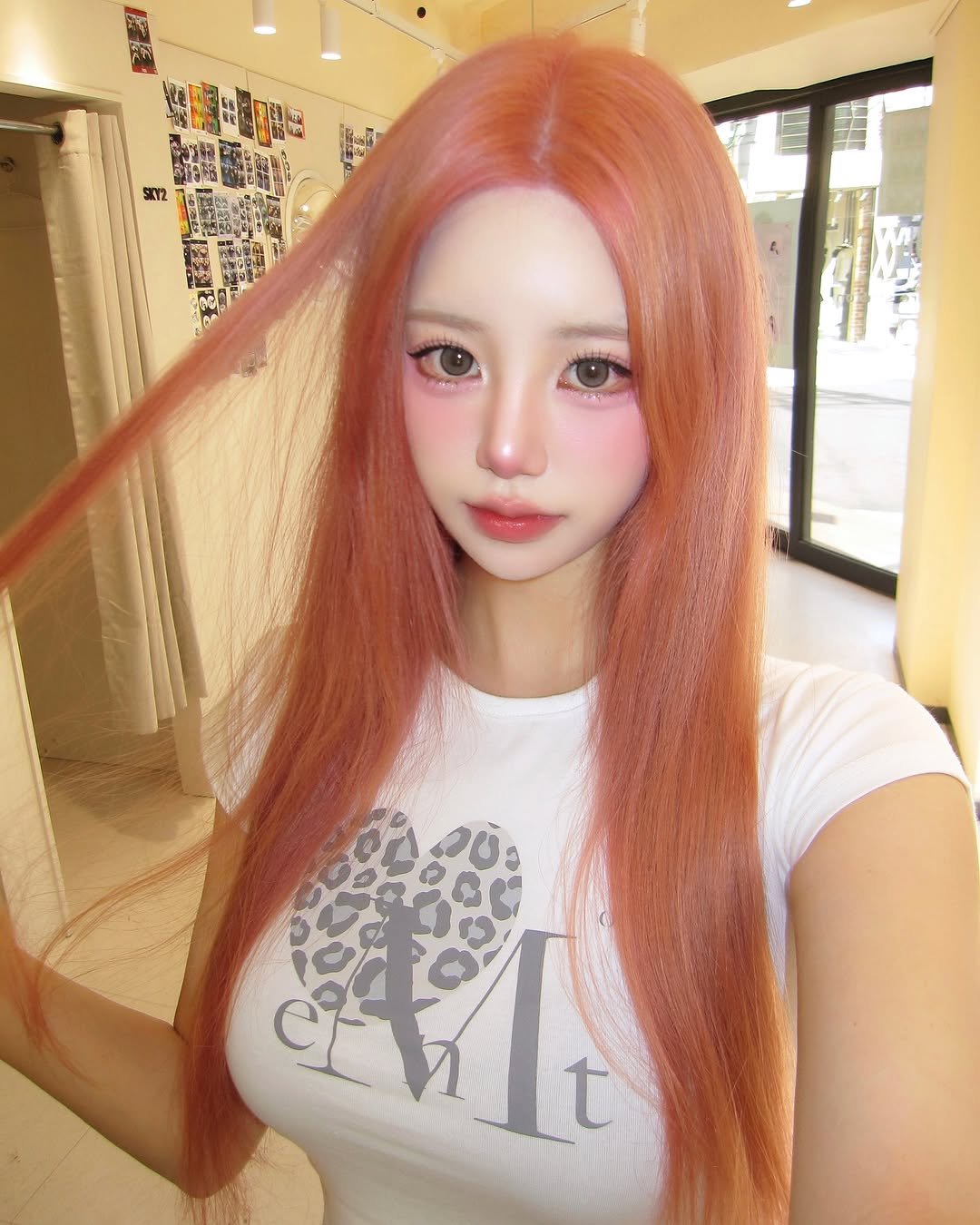 Photo shared by SUJIN ♥ on June 29, 2025 tagging @mu_cent. May be an image of 1 person, blonde hair, braids, long hair and text that says 'ርቲራዋ SKY2 አስሳ ደ'.