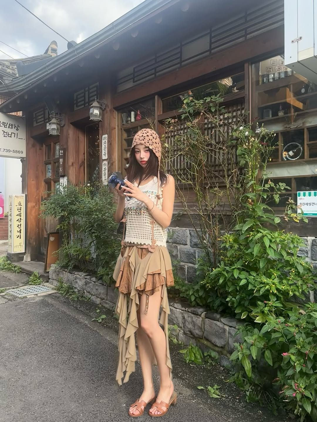 Photo by 김율 MINT on September 14, 2025. May be an image of 1 person, sarong and text.
