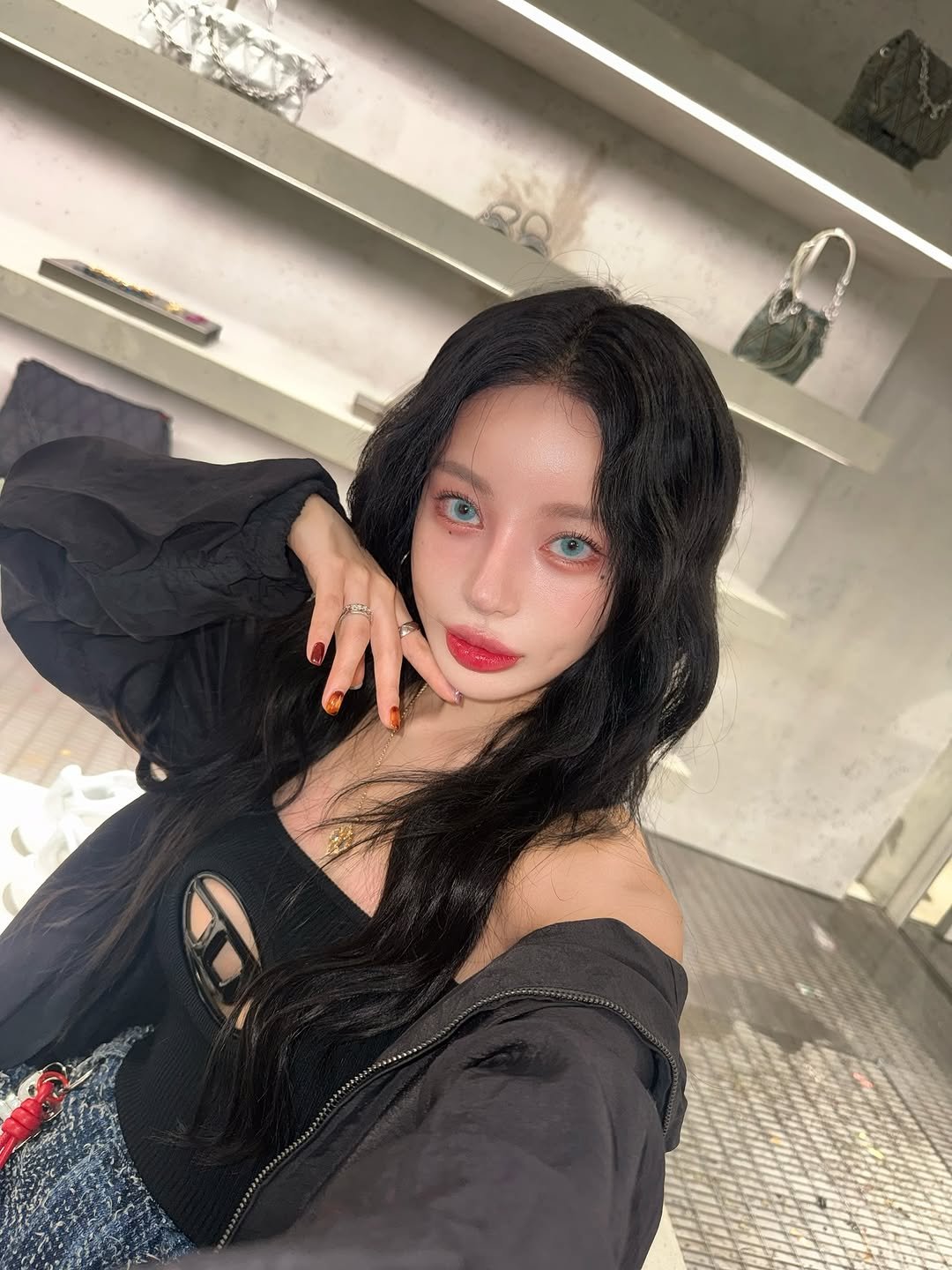 Photo shared by 김율 MINT on October 29, 2025 tagging @diesel. May be an image of one or more people, hair, top and text.