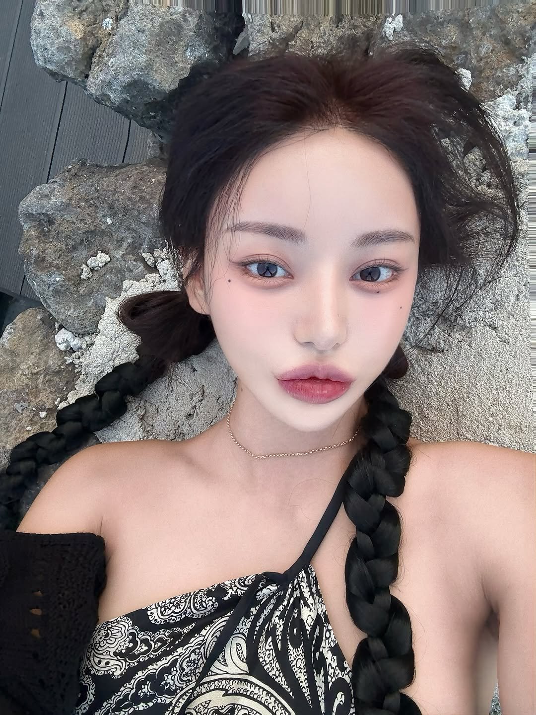 Photo by 김율 MINT on September 13, 2025. May be an image of 1 person, braids, makeup and text.