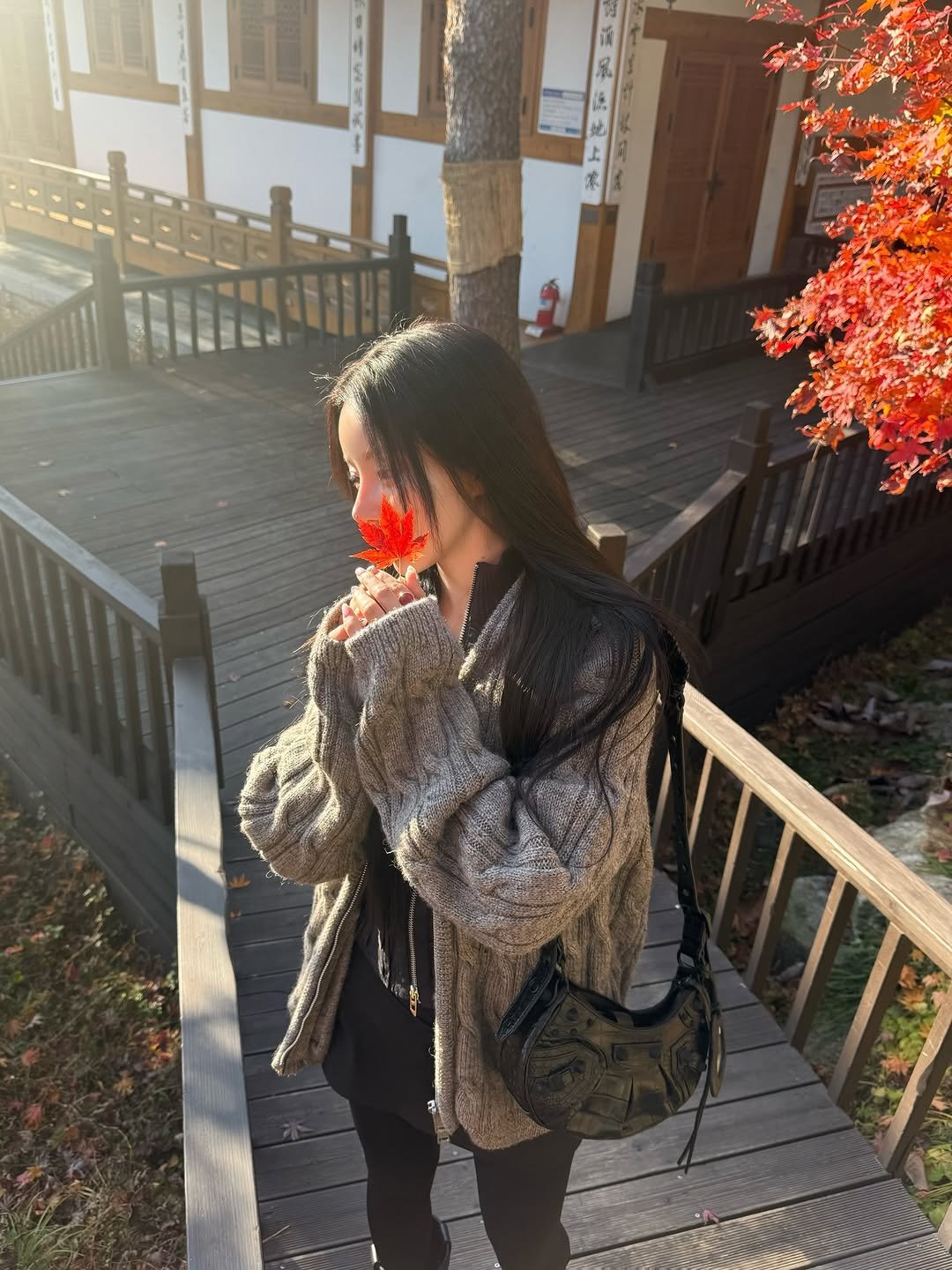 Photo by 김율 MINT on November 26, 2025. May be an image of duffle coat, overcoat, jacket, parka and text.