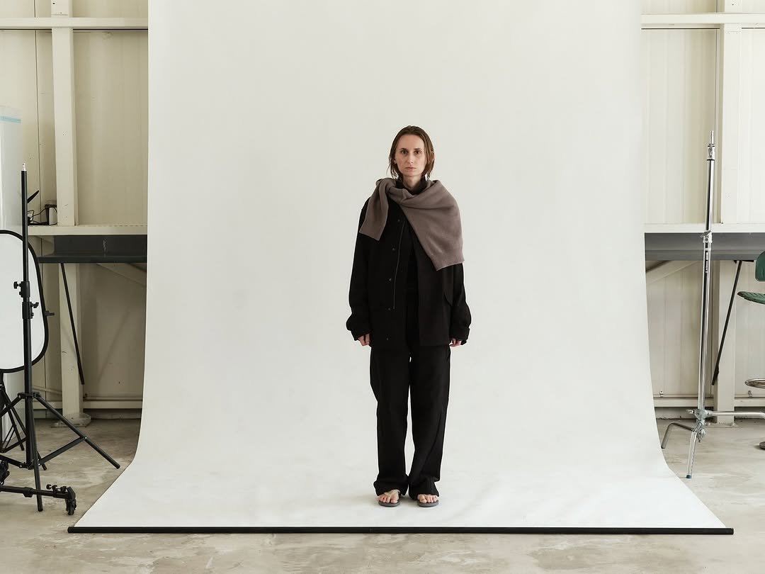 Photo by EPICENTER.TOURIST on November 05, 2025. May be an image of cloak, wool, turtleneck, outerwear and text.