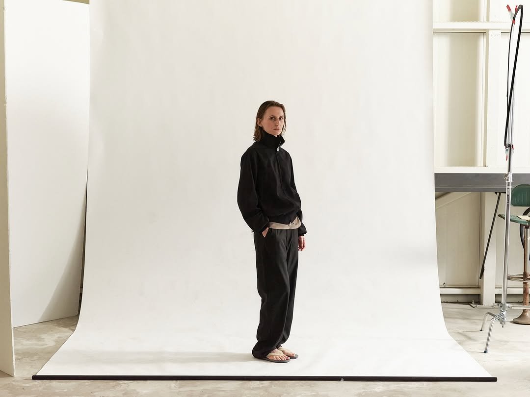 Photo by EPICENTER.TOURIST on October 23, 2025. May be an image of outerwear, turtleneck, sweatpants and text.