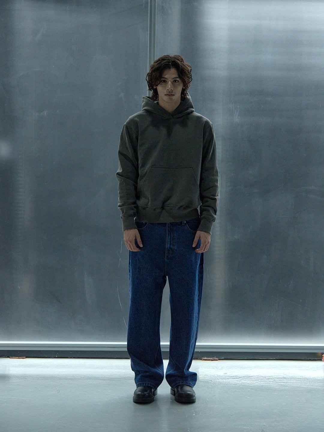 Photo by EPICENTER.TOURIST on October 08, 2025. May be an image of 1 person, standing, sweatpants, parka and text.