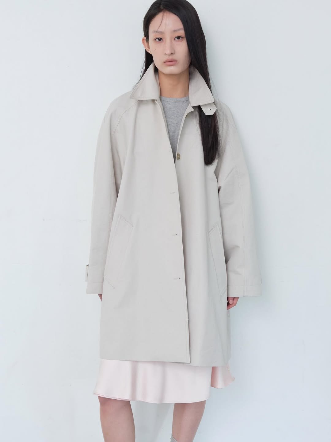 Photo shared by Equa 에쿠아 on March 16, 2026 tagging @equa.kr. May be an image of overcoat, duffle coat, jacket, raincoat, parka and text.