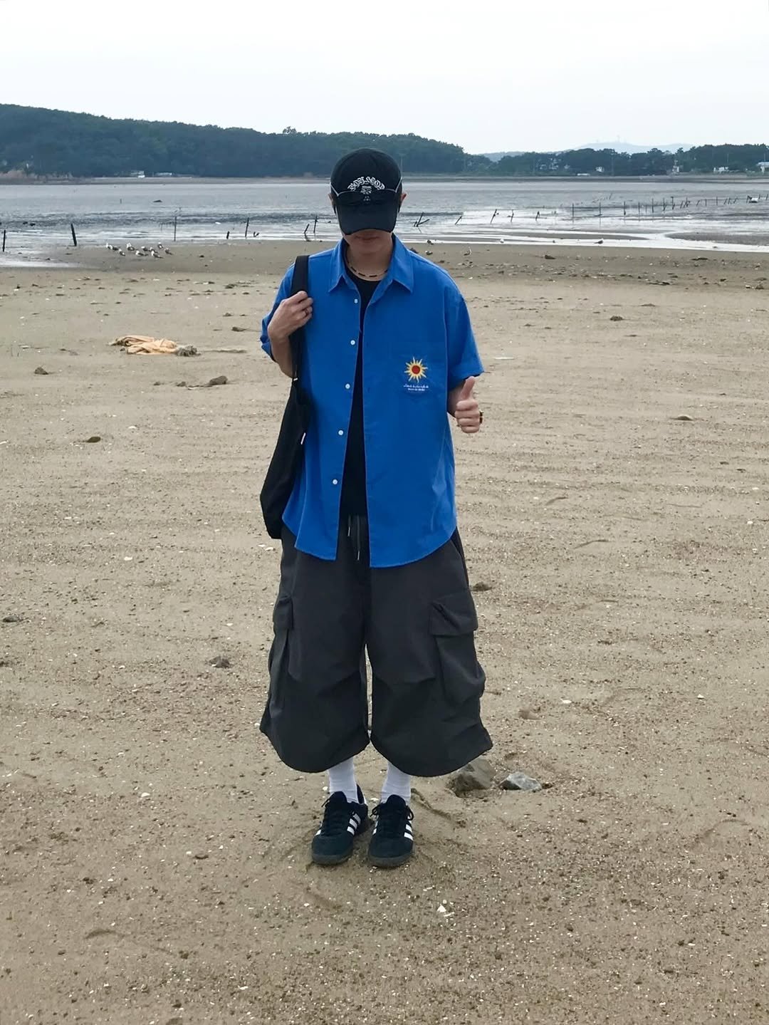 Photo by 동우 / 이퀄 on July 28, 2025. May be an image of 1 person, ocean, beach, coast and text.