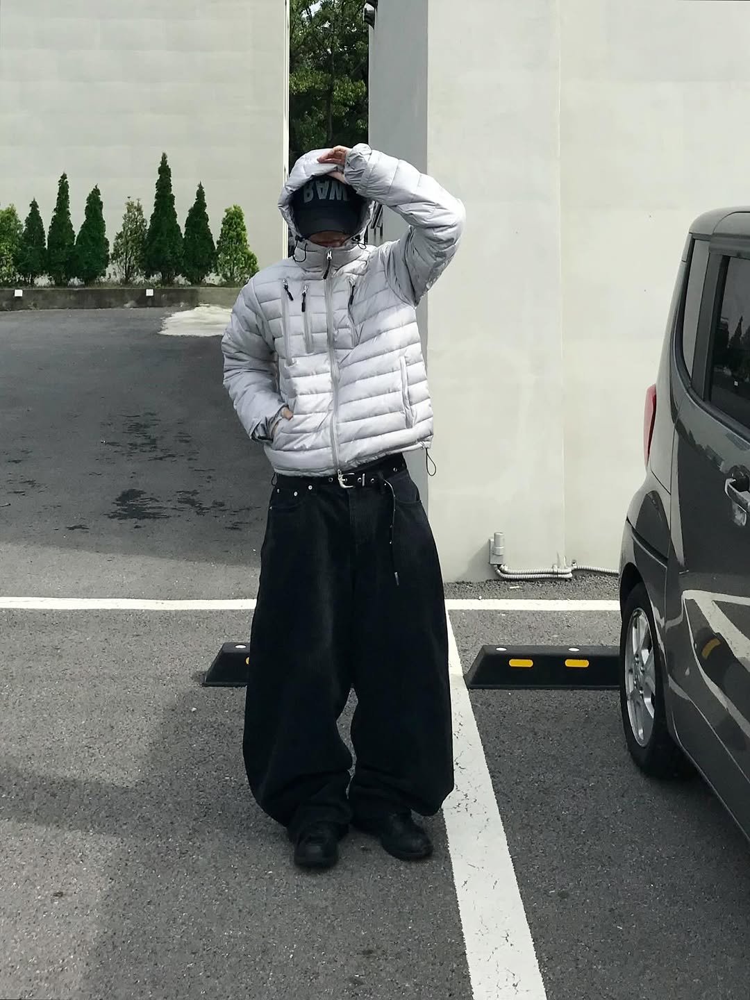 Photo shared by 동우 / 이퀄 on November 03, 2025 tagging @equal_kr. May be an image of standing, parka, coat, face mask and text.