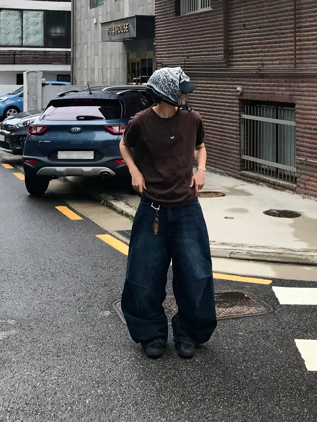 Photo shared by 동우 / 이퀄 on September 07, 2025 tagging @equal_kr. May be an image of 1 person, hat, street and text.