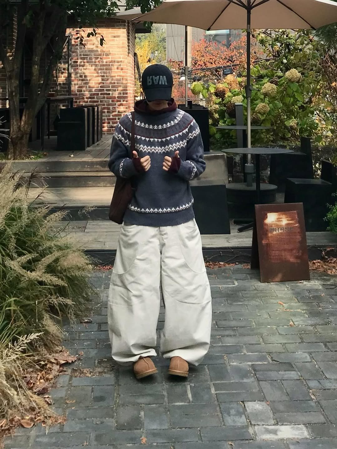 Photo shared by 동우 / 이퀄 on December 10, 2025 tagging @equal_kr. May be an image of duffle coat, overcoat, goosedown coat, sweatpants, sweater, fleece, turtleneck, sweatsuit, parka, jacket and text.