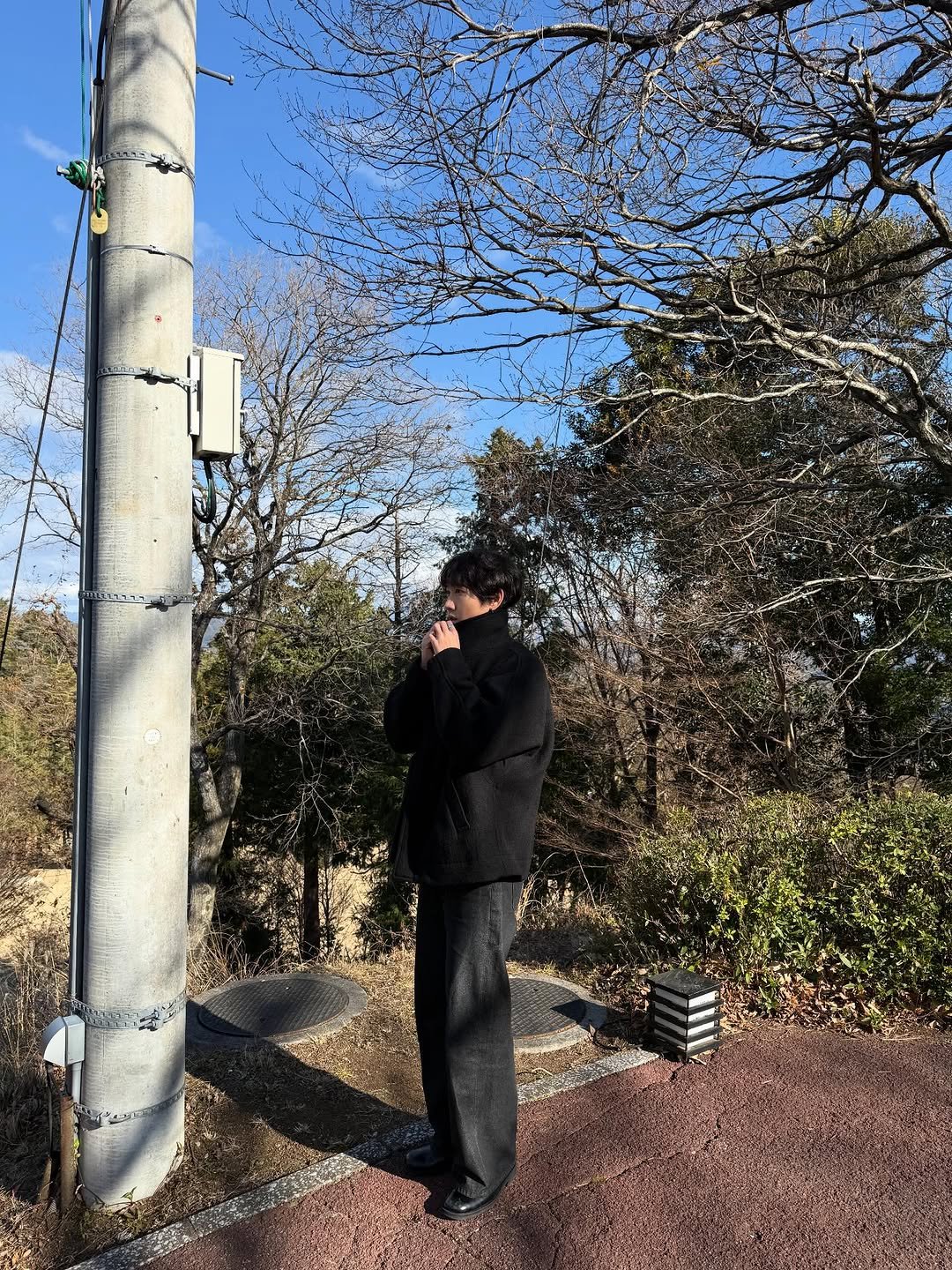 Photo by eric park on January 12, 2026. May be an image of standing, parking meter, binoculars, tree, telephone pole and park.