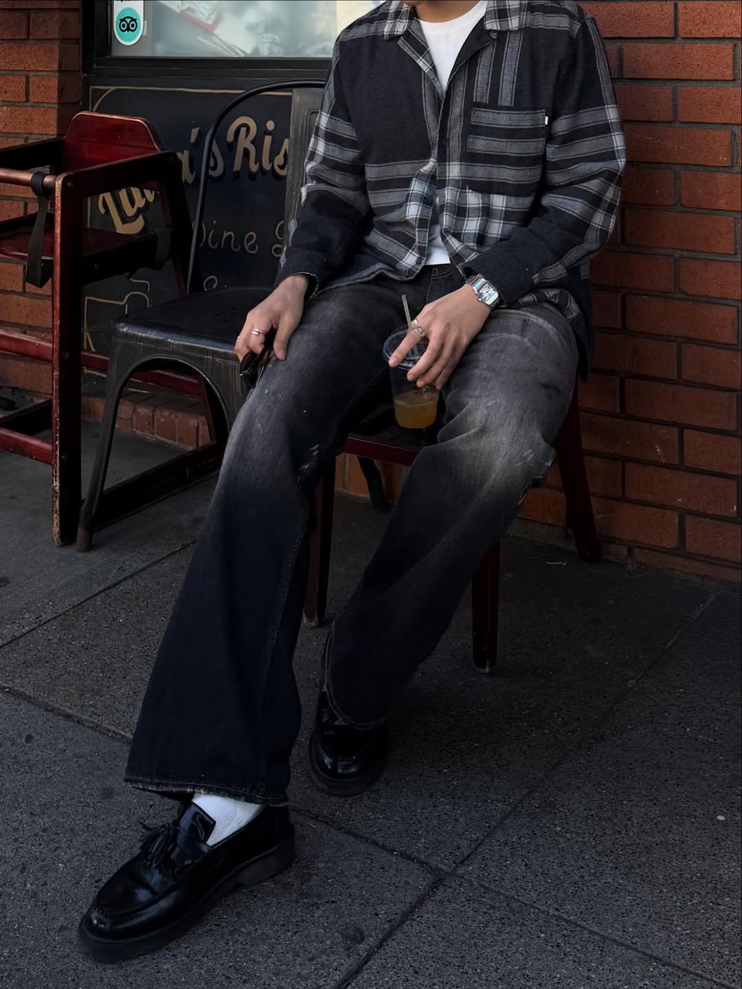 Photo by eric park on January 30, 2026. May be an image of smoking, wingtip shoes, duffle coat, beret, cigarette and text.