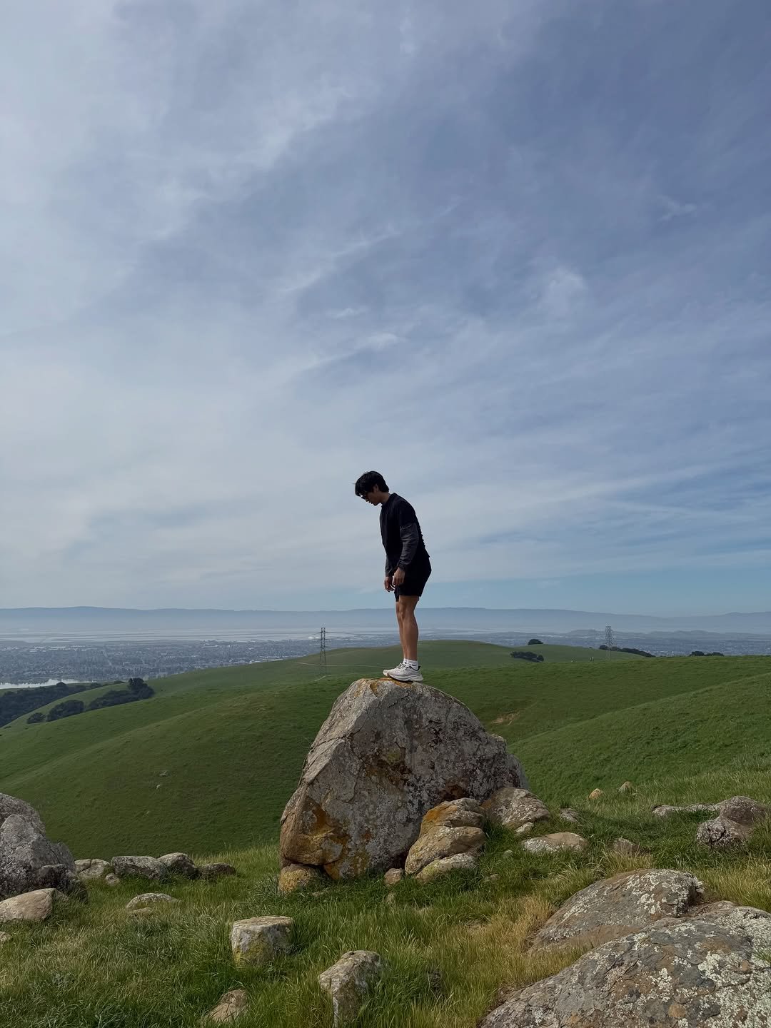 Photo by eric park on March 26, 2026. May be an image of Arthur's Seat, mountain, horizon and text.
