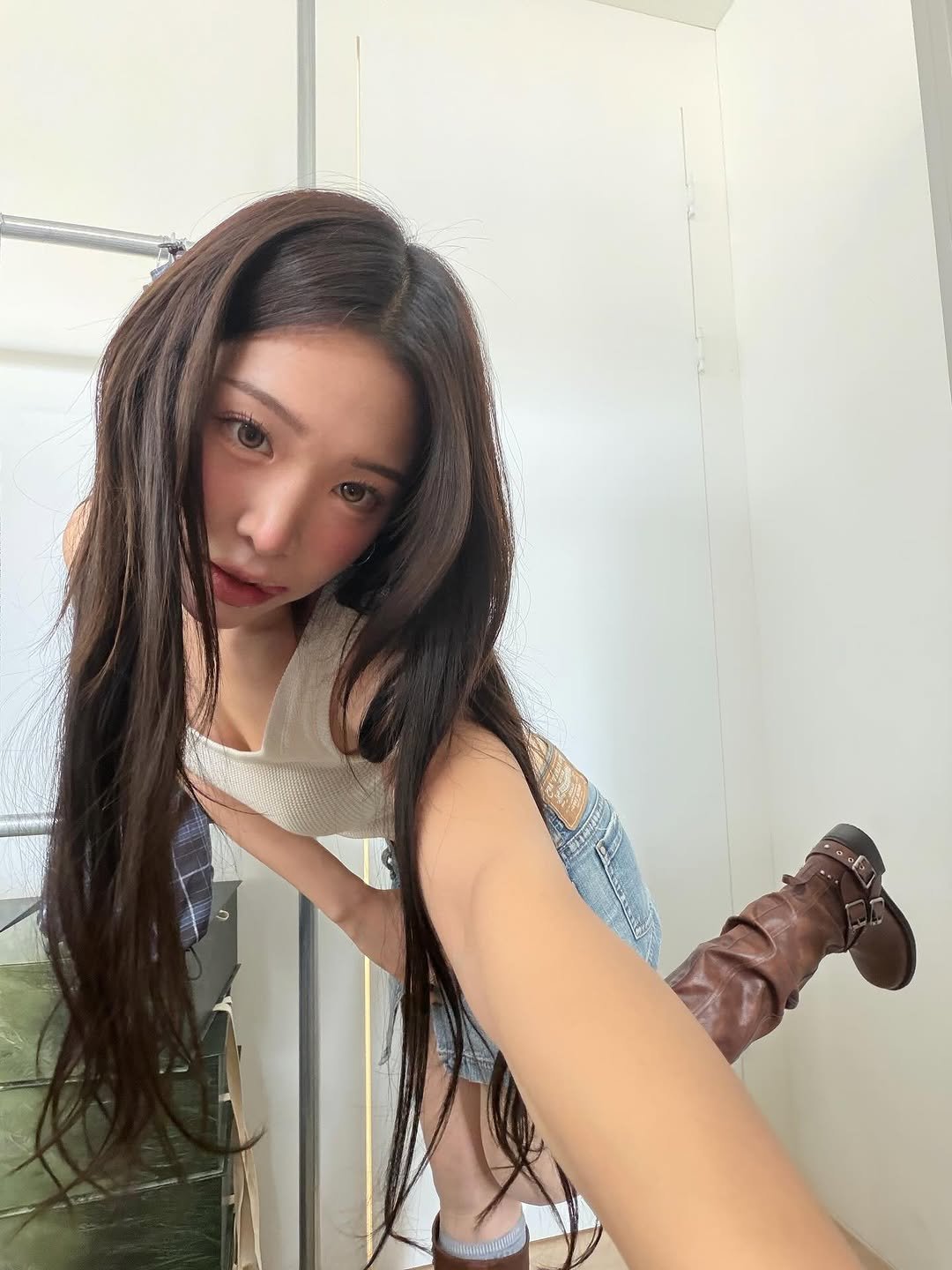 Photo by Eunji Hong on November 06, 2025. May be an image of one or more people, braids, boots and text.