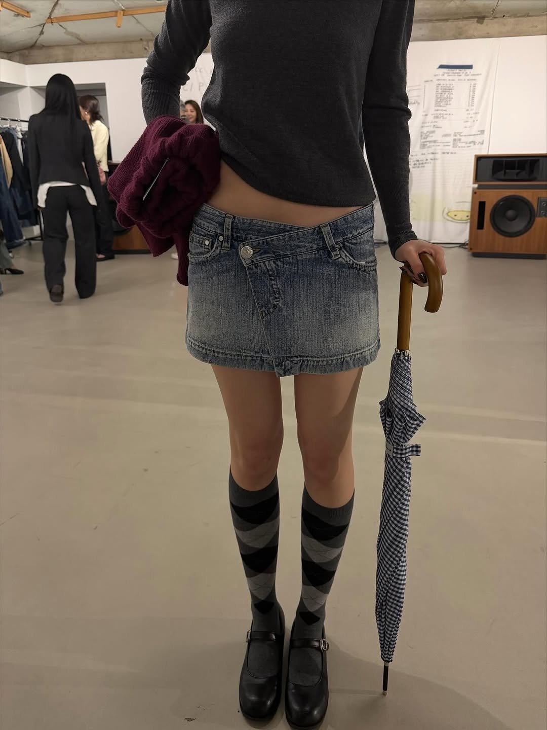 Photo shared by Eunji Hong on November 01, 2025 tagging @nhogirl. May be an image of standing, umbrella, parasol, sock, bowler hat, miniskirt, kilt and text.