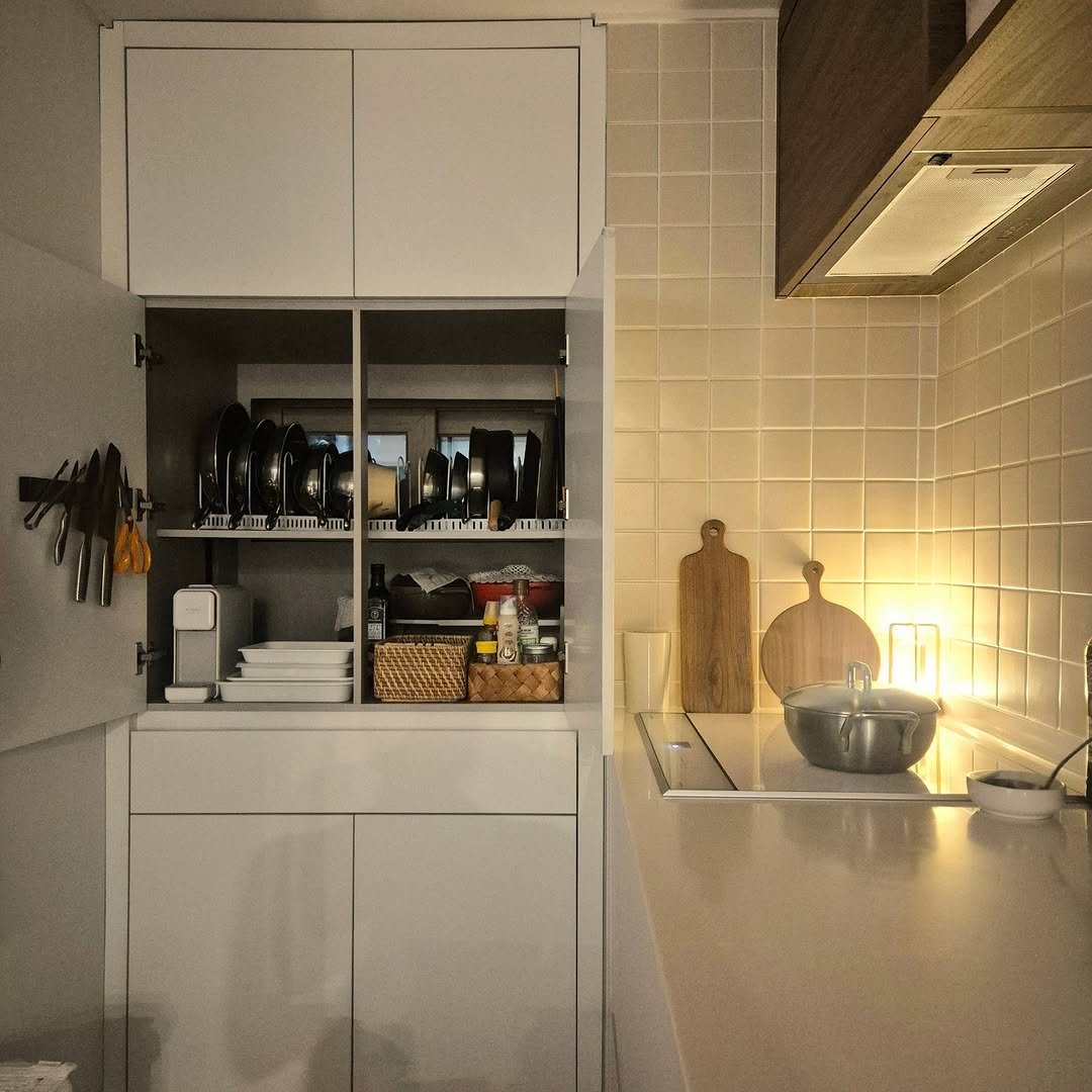 Photo by 은하수 on December 30, 2025. May be an image of sink, range hood, lighting, countertop, rack, indoors, kitchen and text.
