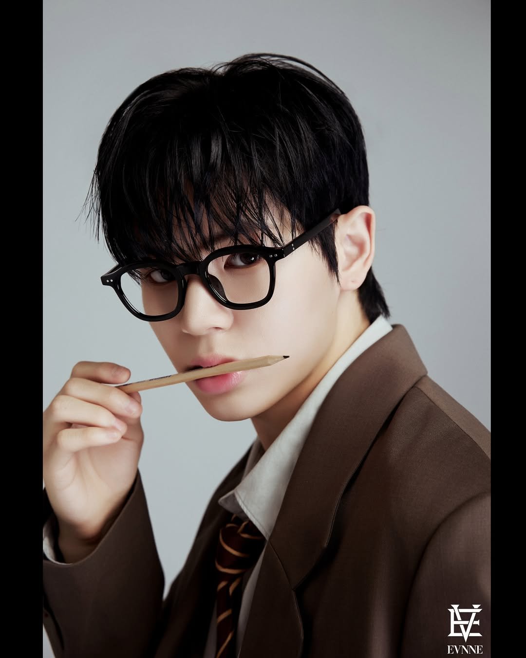 Photo by EVNNE on March 12, 2026. May be an image of duffle coat, eyeglasses, bolo tie and text.