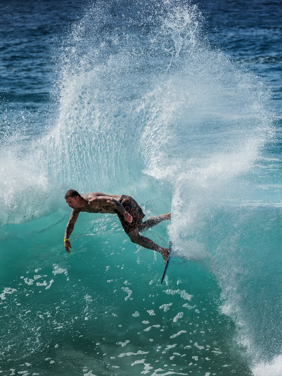 Photo shared by Tim Fulton on April 26, 2026 tagging @sullenclothing, @creaturesofleisure, @machinegunkelly, @exileskimboards, and @cam_leflan. May be an image of surfboard, wetsuit, water and text.