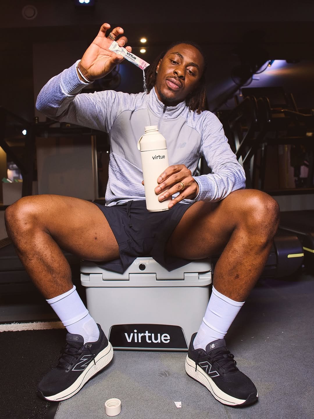 Photo shared by Ebere Eze on April 01, 2026 tagging @virtuedrinks. May be an image of ‎activewear, shaker, sneakers, jug, sportswear, water bottle and ‎text that says '‎20 分の virtue دسر virtua virtue‎'‎‎.