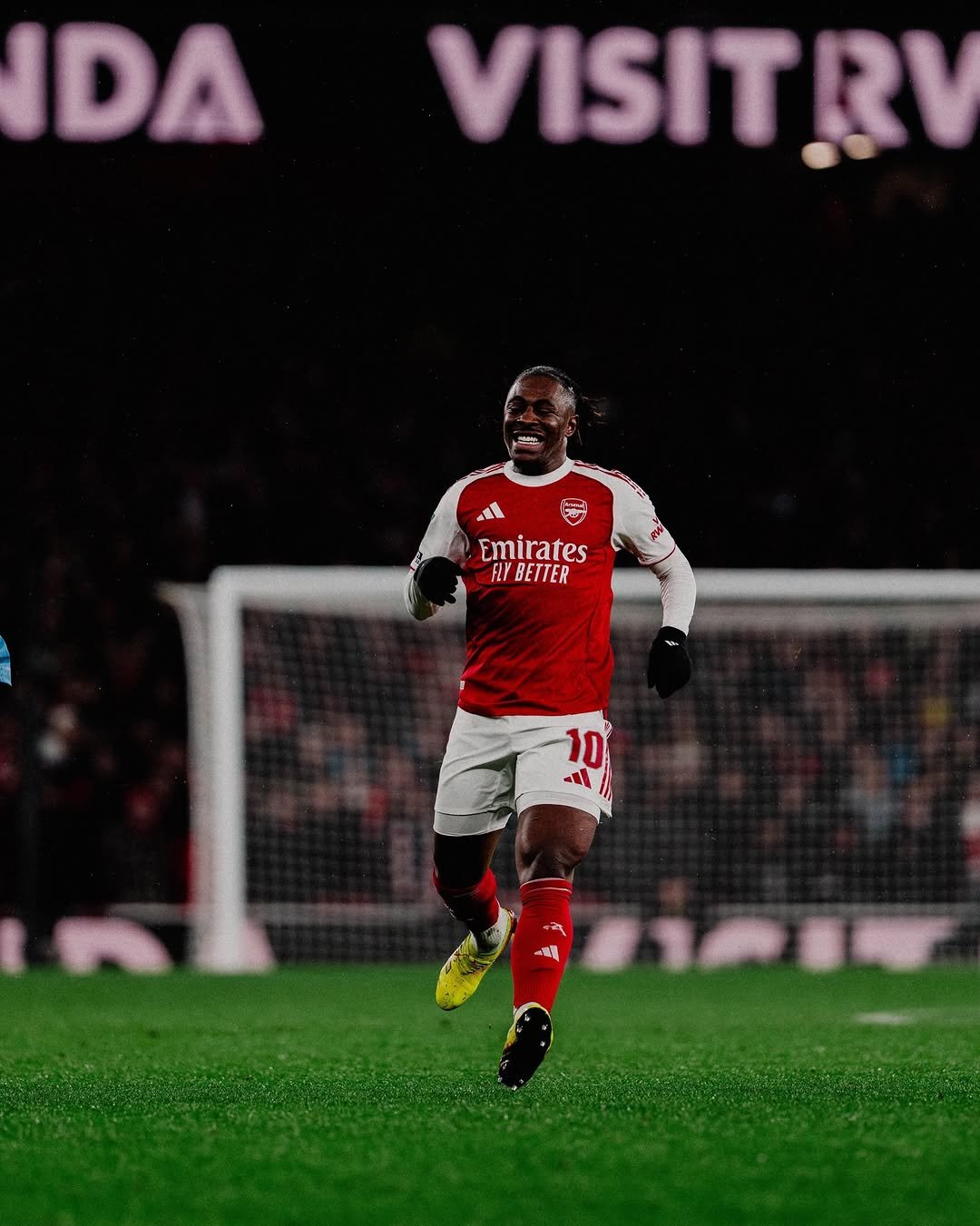 Photo shared by Ebere Eze on February 03, 2026 tagging @arsenal, @newbalancefootball, and @joelkga. May be an image of football, soccer, stadium and text that says 'IDA VISITRV Emirates FLYBETTER FLY 10 10 Il 一番場'.