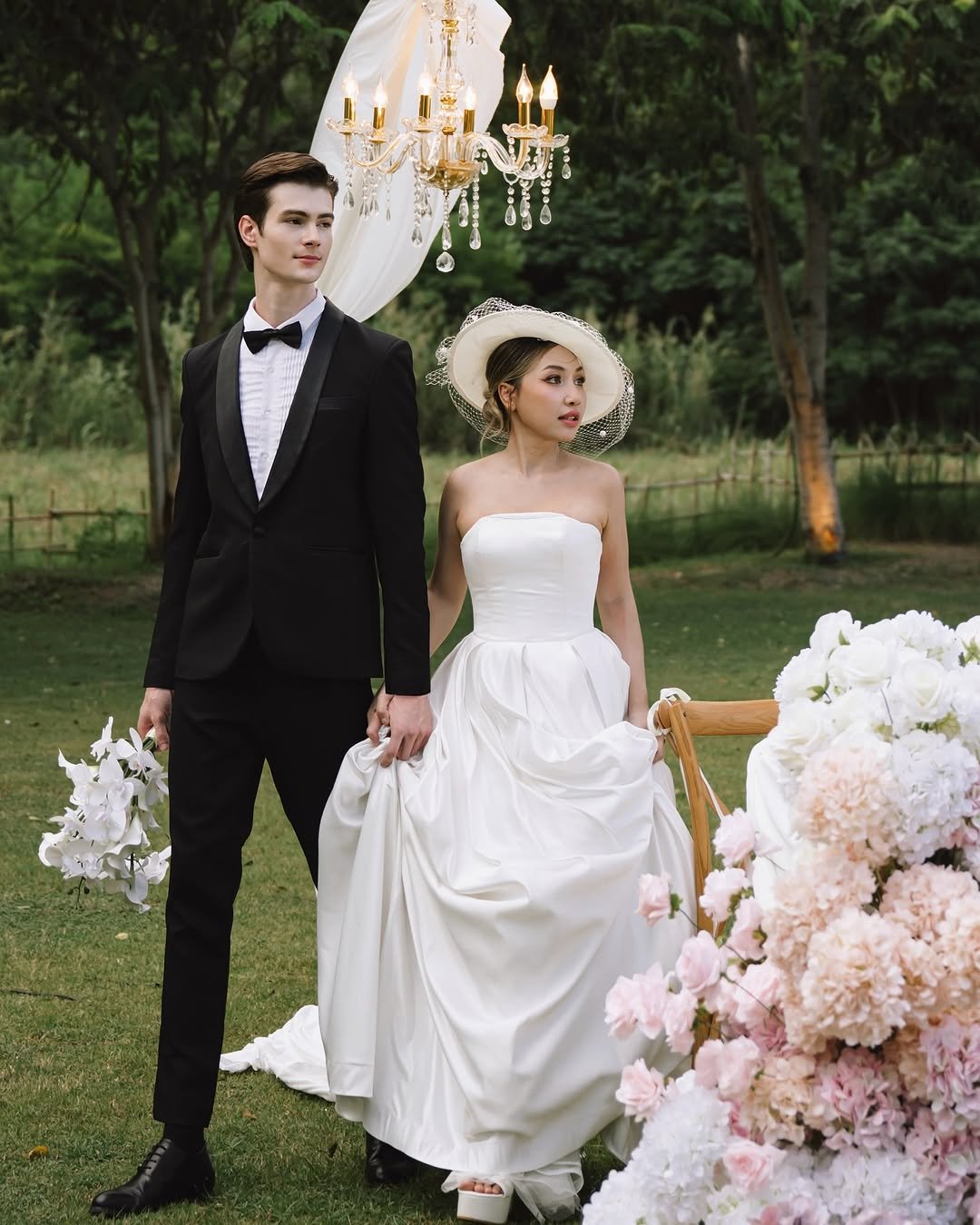 Photo by Ruslan Mamlay on August 21, 2025. May be an image of 2 people, candle holder, gown, wedding and text.