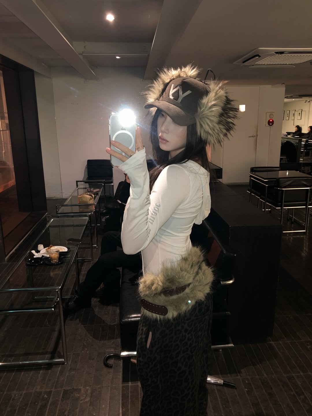 Photo shared by 동화 on January 15, 2026 tagging @rockcake_. May be a selfie of hat, fur coat, headdress, costume, beret and text.