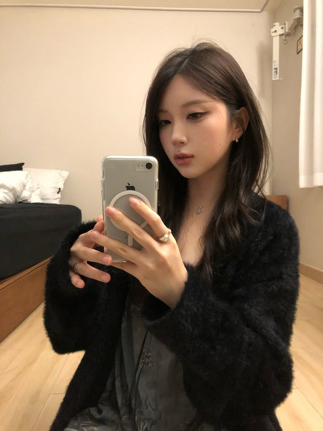 Photo shared by 동화 on November 03, 2025 tagging @yoakekiri.official. May be a selfie of one or more people, hair, duffle coat, phone, parka, jacket, mirror and text.