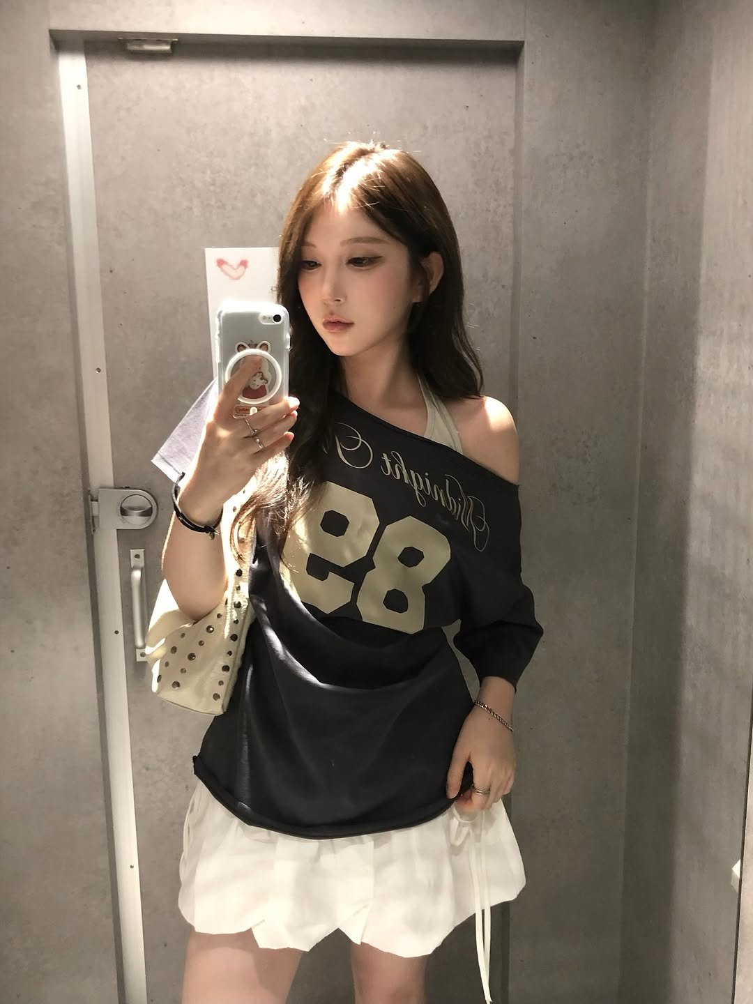Photo shared by 동화 on August 18, 2025 tagging @midnightmove_official. May be an image of 1 person, hair, miniskirt, top, mirror, shorts and text.