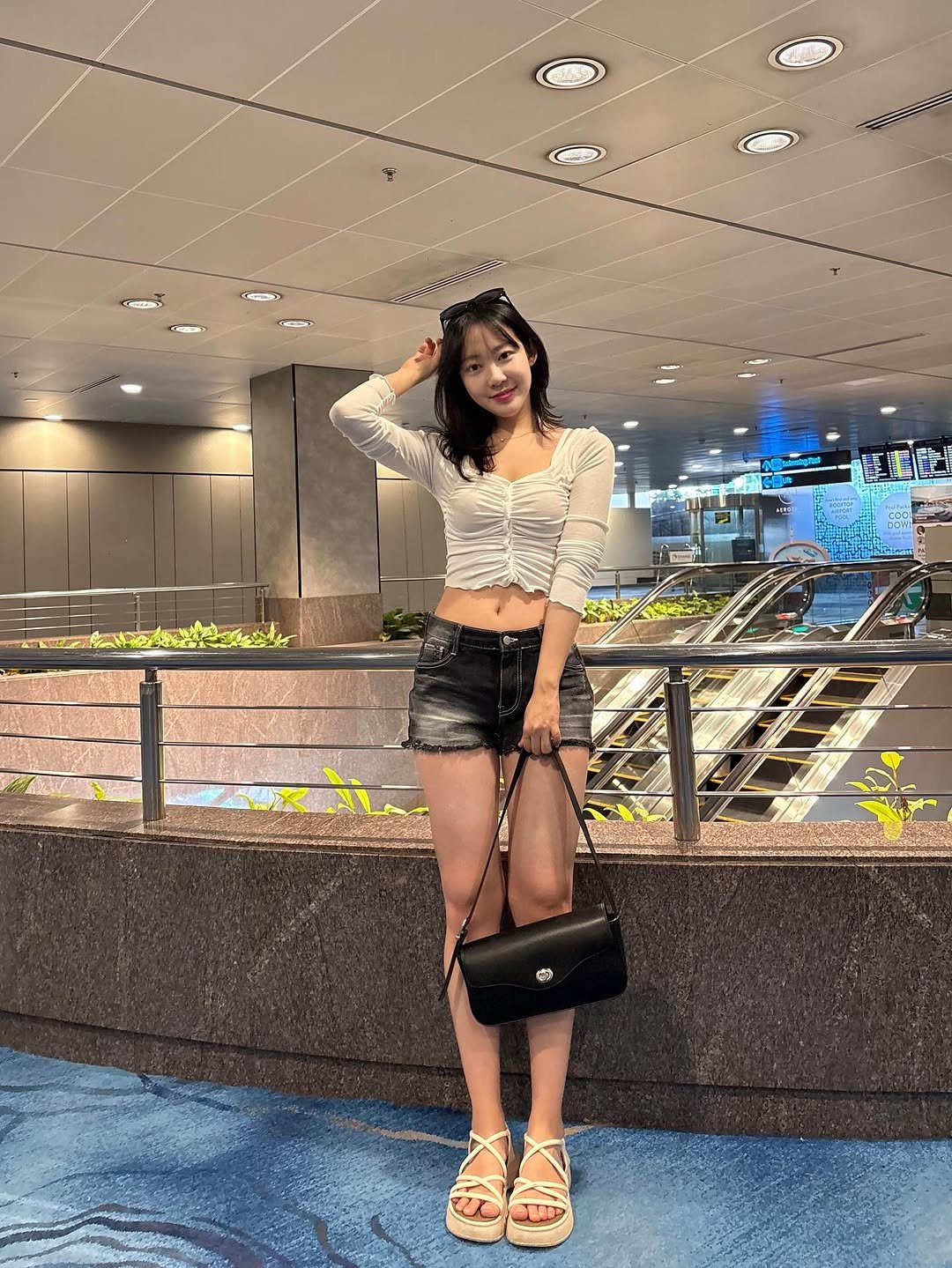 Photo shared by 묘정🐰 on February 07, 2026 tagging @madenrolls. May be an image of miniskirt, shorts, terminal and text.