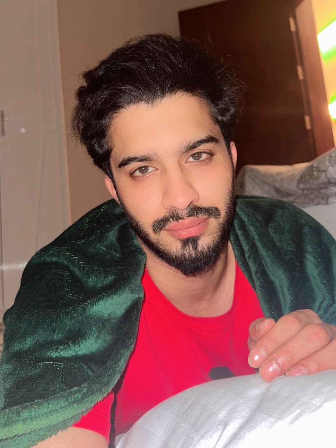Photo by Faiz Baloch in Al Masjid an Nabawi  المسجد النبوي  Madina Munawarah المدينة المنورة. May be a selfie of one or more people, beard, hair, robe, bath robe, blanket, bedroom and text.