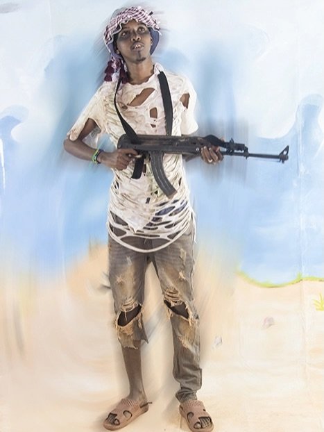 Photo shared by fake magazine 페이크 매거진 on April 28, 2026 tagging @janhoekjoh. May be an image of gas mask, sling, costume, bandanna and text.