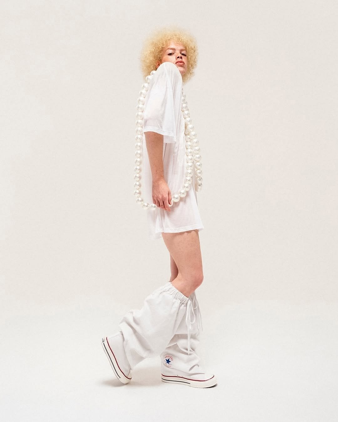 Photo shared by fake magazine 페이크 매거진 on November 10, 2025 tagging @converse, @vaquera.nyc, and @cortisastar. May be an image of one or more people, makeup and text.