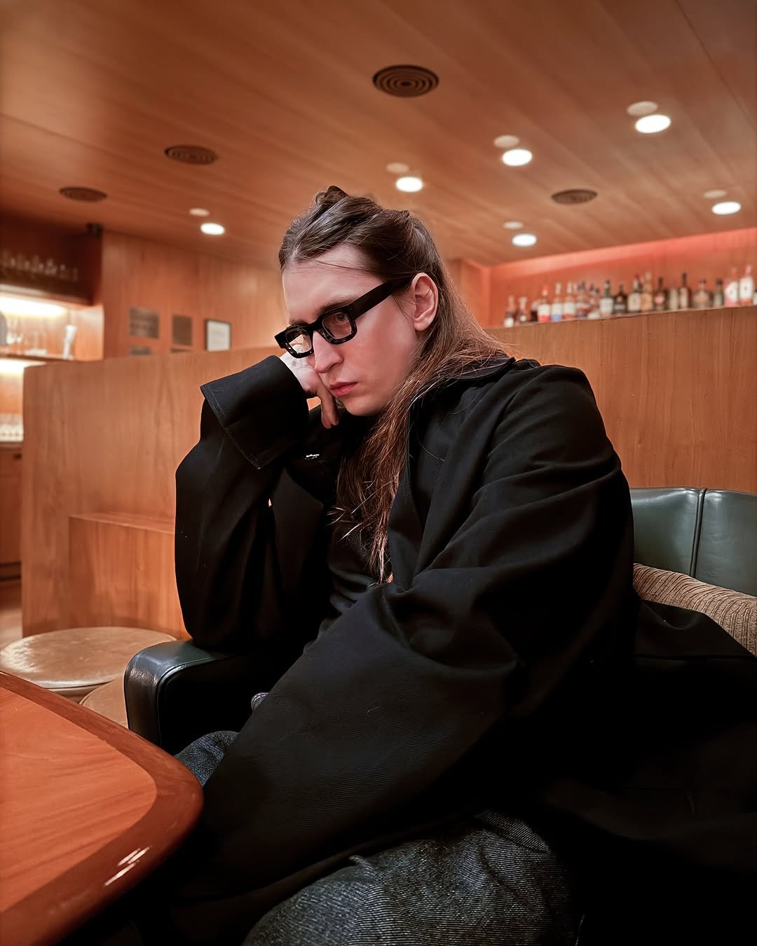 Photo by Felipe Bressanim on September 30, 2025. May be an image of eyewear, bolo tie and turtleneck.