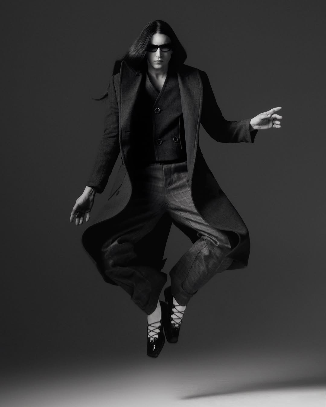 Photo by Felipe Bressanim on November 02, 2025. May be a black-and-white image of overcoat, suit and text.