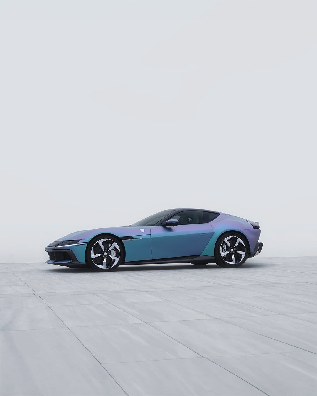 Photo by Ferrari on January 19, 2026. May be an image of car, convertible, roadster, wheel, road and text.