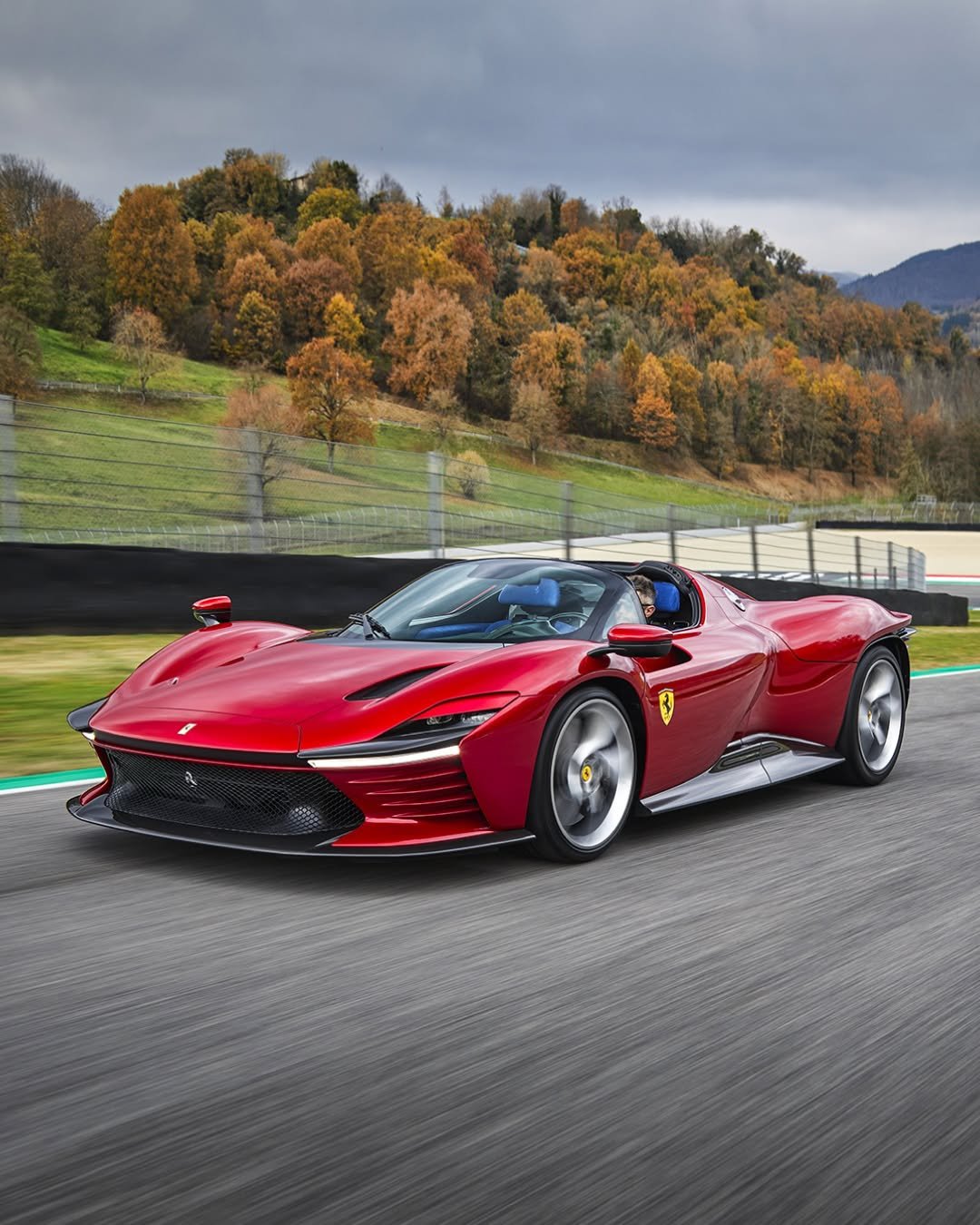 Photo by Ferrari APAC on December 31, 2025. May be an image of wheel, race car, road and text.