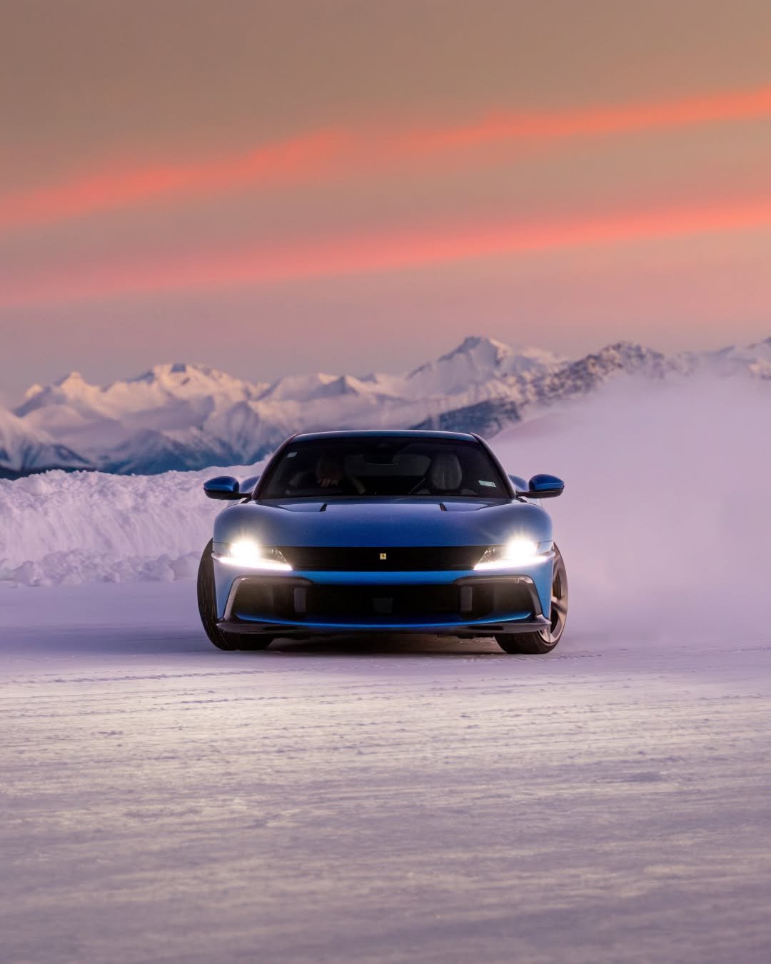 Photo by Ferrari APAC on December 24, 2025. May be an image of blower, wheel, race car, arctic, road, snow and text.