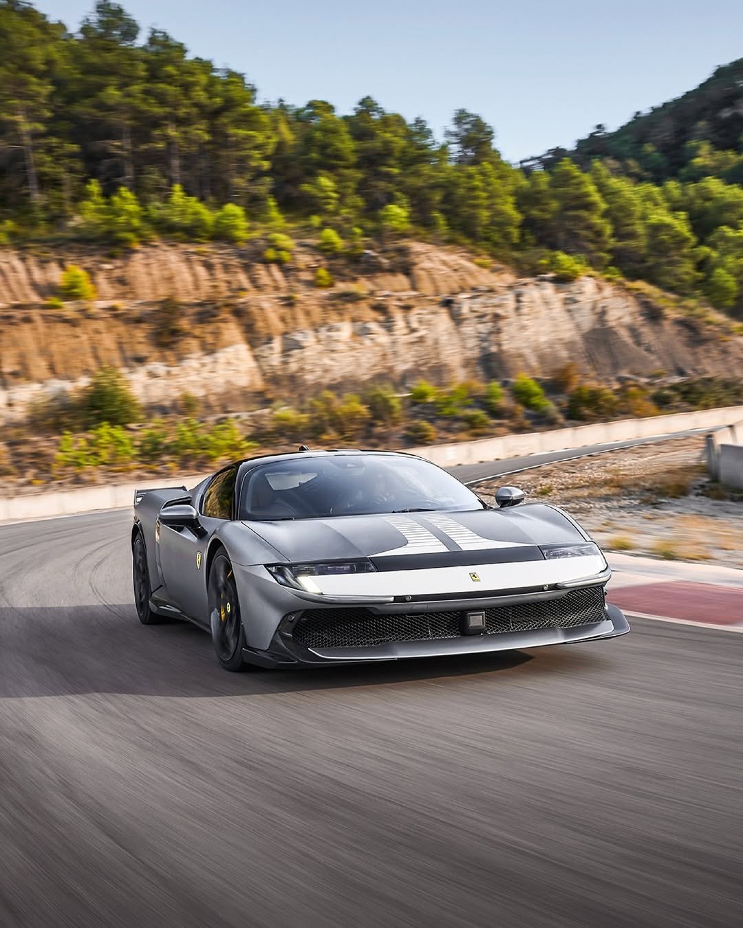 Photo by Ferrari APAC on February 13, 2026. May be an image of wheel, race car, sedan, roadster, road and text.