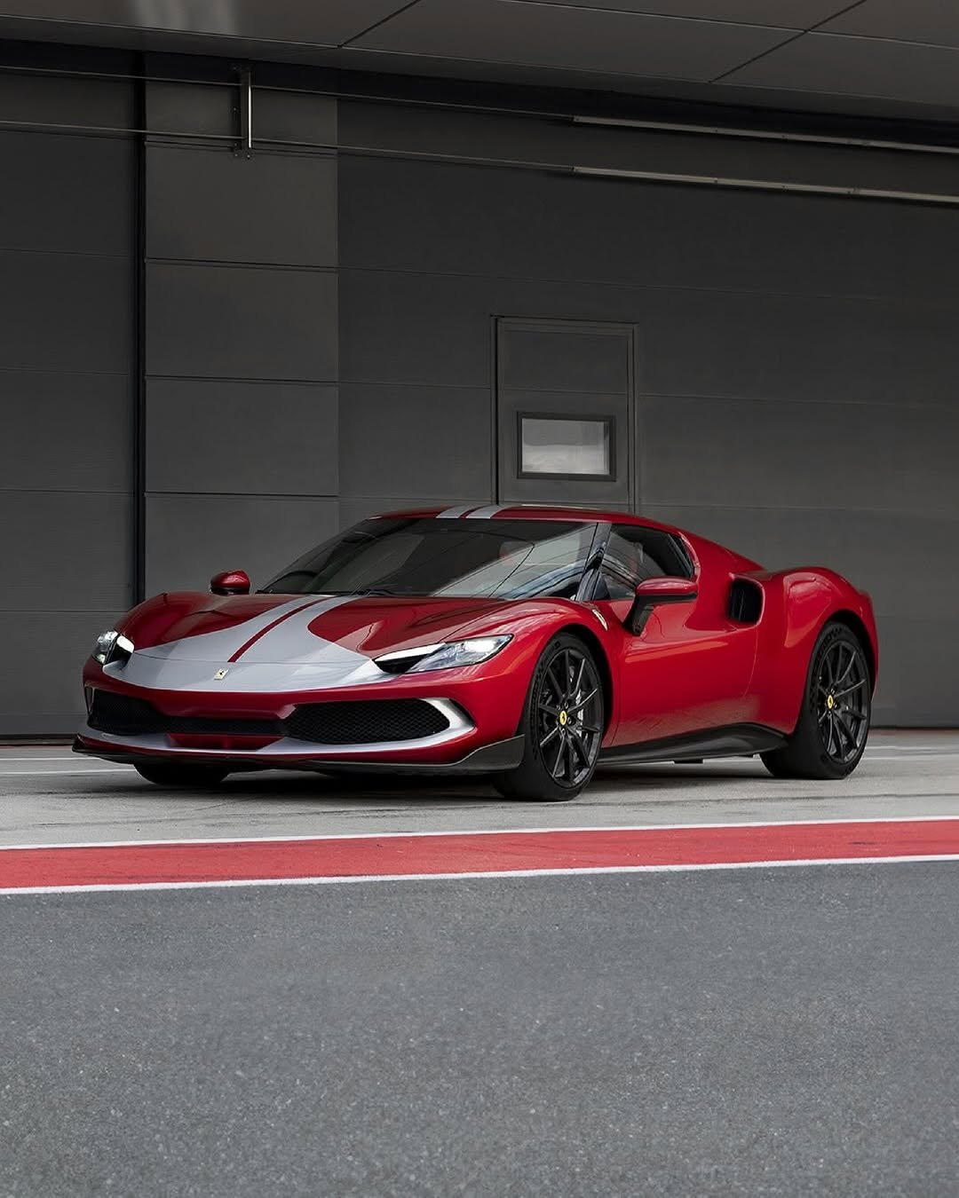 Photo by Ferrari APAC on February 22, 2026. May be an image of car, wheel, roadster and text.
