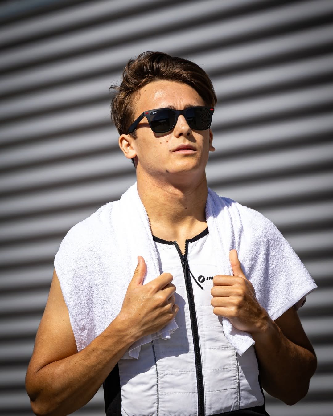 Photo shared by Scuderia Ferrari Driver Academy on January 16, 2026 tagging @dinobeganovic_. May be an image of one or more people, people playing tennis, sportswear, glasses, racket, sunglasses and text that says 'IN'.