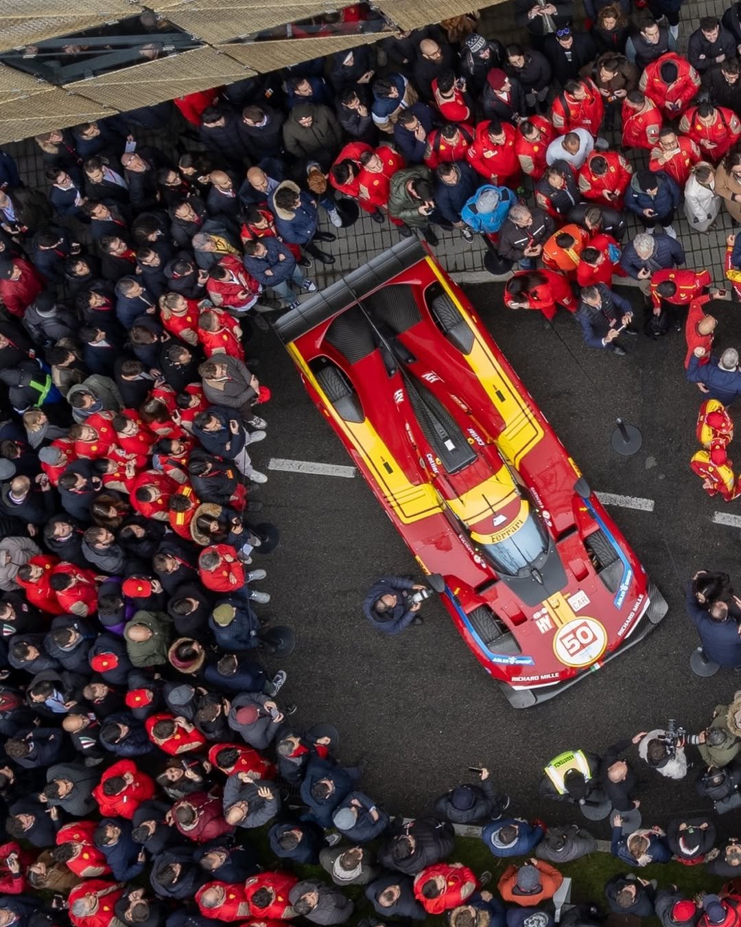 Photo shared by Ferrari Hypercar on January 05, 2026 tagging @miguelmolinam2, @_nicklasnielsen, @antonio_fuoco1, and @afcorse_official. May be an image of racing vehicles, race car, crowd and text.
