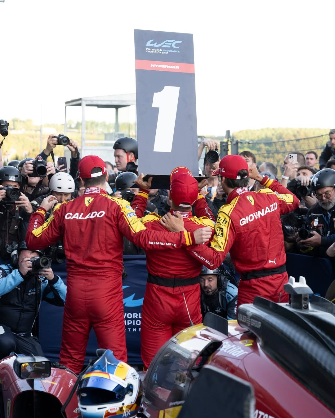 Photo shared by Ferrari Hypercar on January 08, 2026 tagging @antogiovinazzi99, @ale_pierguidi, @afcorse_official, and @jamescalado. May be an image of racing vehicles, race car, helmet and text.