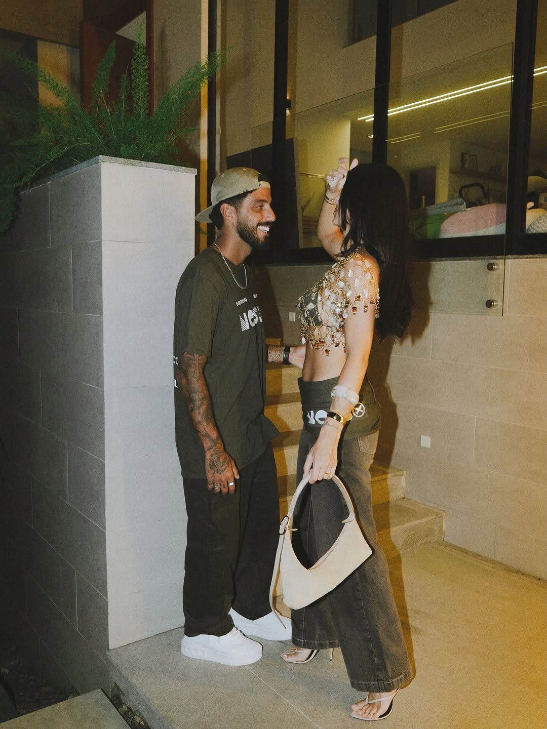 Photo shared by Filipe Toledo on February 18, 2026 tagging @anandamarcal. May be an image of people kissing, night and text.