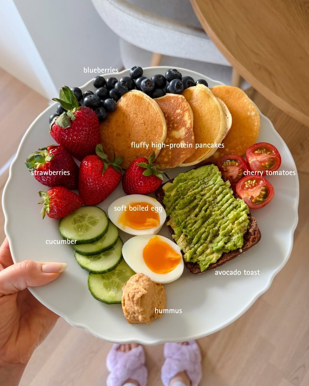 Photo by Selma | easy healthy recipes on April 16, 2026. May be an image of strawberry, poached egg, egg yolk, pancake, avocado, crumpet, boiled egg, toast and text that says 'blueberries fluffy high-protein pancakes strawberries cherry cherrytomatoes tomatoes soft boiled softboiledegg egg cucumber avocado avocadotoast toast hummus'.