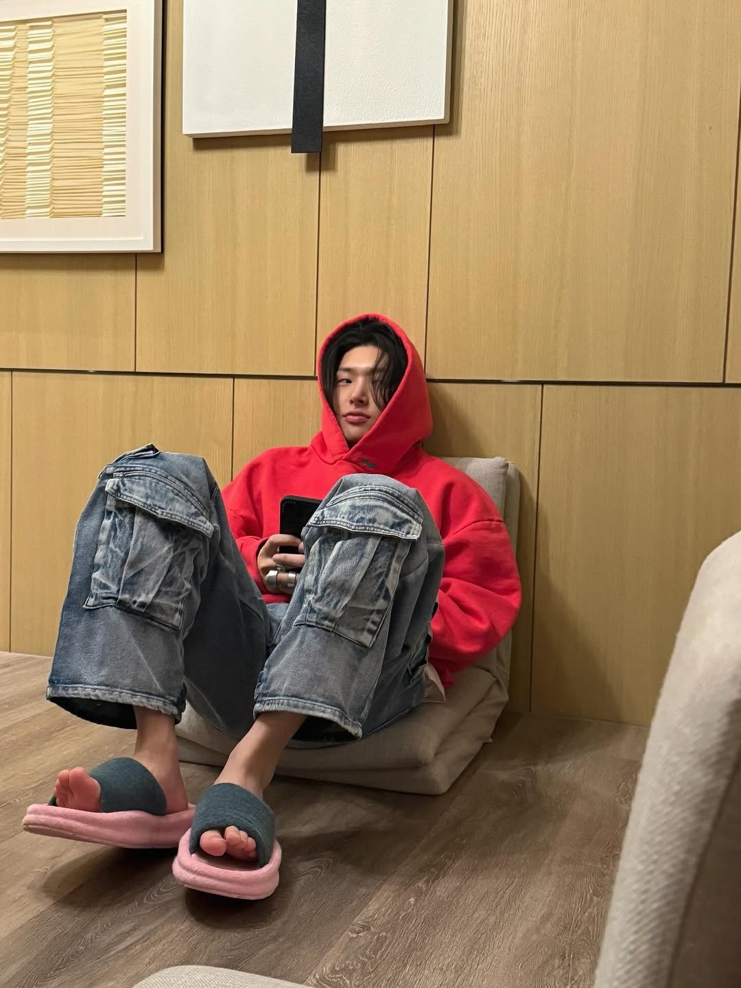 Photo by 민기 (MINGI) on December 05, 2025. May be an image of duffle coat, sandals, sweatpants and text.